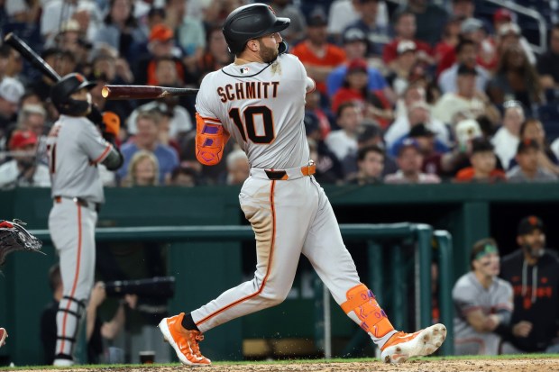 San Francisco Giants' Casey Schmitt hits a home run during the seventh inning of a baseball game against the Washington Nationals, Friday, April 17, 2026, in Washington. (AP Photo/Daniel Kucin Jr.)