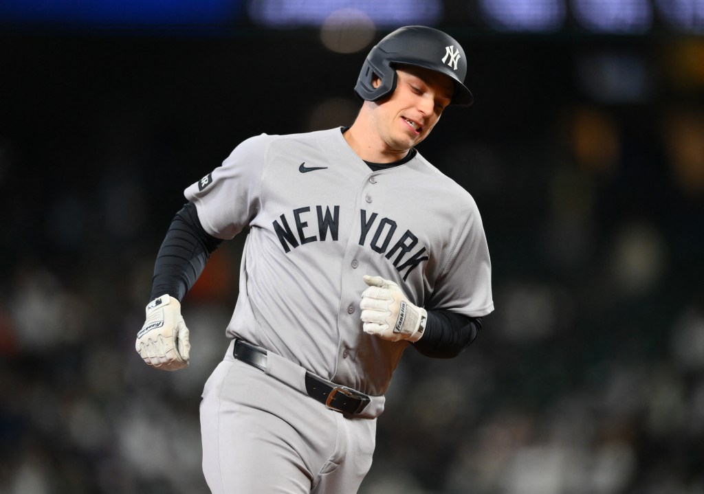 Ben Rice rounds the bases after hitting a solo home run in the ninth inning of the Yankees' win over the Mariners.