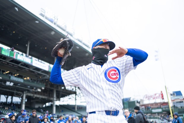 Chicago Cubs first baseman Michael Busch warms up ahead of a game against the Los Angeles Angels at Wrigley Field in Chicago on Wednesday, April 1, 2026. (Josh Boland/Chicago Tribune)