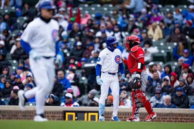 Chicago Cubs center fielder Pete Crow-Armstrong speaks to Los Angeles Angels catcher Travis D'Arnaud at home plate while at bat during the second inning of a game against the Los Angeles Angels at Wrigley Field in Chicago on Wednesday, April 1, 2026. (Josh Boland/Chicago Tribune)