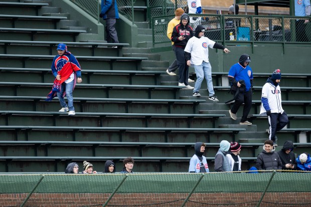 Chicago Cubs fans find their seats ahead of a game against the Los Angeles Angels at Wrigley Field in Chicago on Wednesday, April 1, 2026. (Josh Boland/Chicago Tribune)