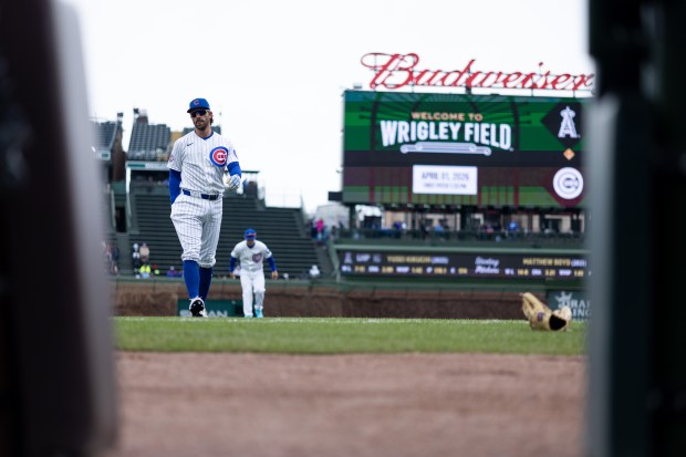 Chicago Cubs shortstop Dansby Swanson warms up ahead of a game against the Los Angeles Angels at Wrigley Field in Chicago on Wednesday, April 1, 2026. (Josh Boland/Chicago Tribune)