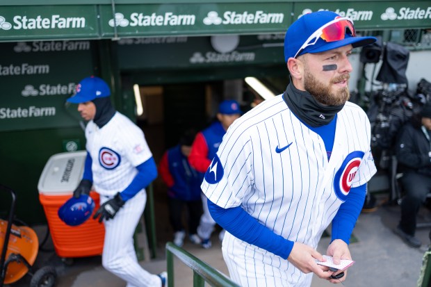 Chicago Cubs first baseman Michael Busch walks out of the dugout ahead against the Los Angeles Angels at Wrigley Field in Chicago on Wednesday, April 1, 2026. (Josh Boland/Chicago Tribune)