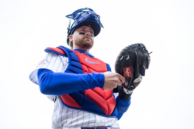 Chicago Cubs catcher Carson Kelly warms up ahead of a game against the Los Angeles Angels at Wrigley Field in Chicago on Wednesday, April 1, 2026. (Josh Boland/Chicago Tribune)