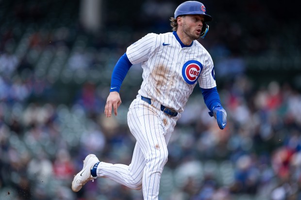Chicago Cubs second baseman Nico Hoerner runs towards third base during the third inning of a game against the Los Angeles Angels at Wrigley Field in Chicago on Wednesday, April 1, 2026. (Josh Boland/Chicago Tribune)