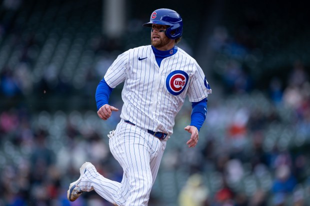 Chicago Cubs catcher Carson Kelly (15) runs towards third during the seventh inning of a game against the Los Angeles Angels at Wrigley Field in Chicago on Wednesday, April 1, 2026. (Josh Boland/Chicago Tribune)