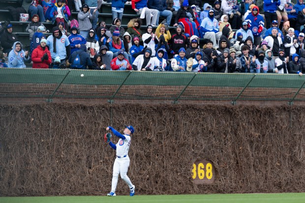 Chicago Cubs center fielder Pete Crow-Armstrong throws a ball to the fans after catching a fly ball during the eighth inning of a game against the Los Angeles Angels at Wrigley Field in Chicago on Wednesday, April 1, 2026. (Josh Boland/Chicago Tribune)
