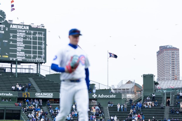 Chicago Cubs center fielder Pete Crow-Armstrong walks off the field as birds swarm the outfield stands during the eighth inning of a game against the Los Angeles Angels at Wrigley Field in Chicago on Wednesday, April 1, 2026. (Josh Boland/Chicago Tribune)