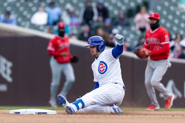 Chicago Cubs left fielder Ian Happ slides into second during the eighth inning of a game against the Los Angeles Angels at Wrigley Field in Chicago on Wednesday, April 1, 2026. (Josh Boland/Chicago Tribune)