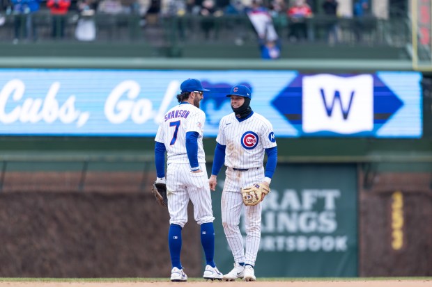 Chicago Cubs shortstop Dansby Swanson (7) and second baseman Nico Hoerner react after defeating the Los Angeles Angels at Wrigley Field in Chicago on Wednesday, April 1, 2026. (Josh Boland/Chicago Tribune)