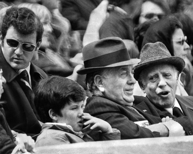 Mayor Richard J. Daley, second from right, attends a Cubs-Cardinals game with his grandson and longtime judge Abraham Lincoln Marovitz, right, on April 26, 1975, at Wrigley Field. (Don Casper/Chicago Tribune)
