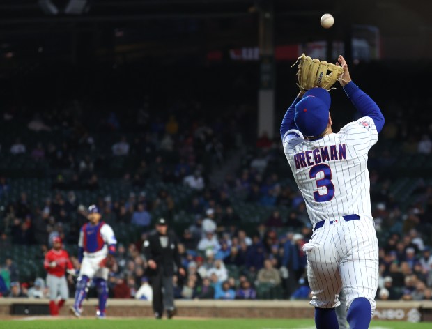 Chicago Cubs third baseman Alex Bregman (3) catches a pop foul hit by Los Angeles Angels catcher Logan O'Hoppe in the second inning of a game at Wrigley Field in Chicago on March 31, 2026. (Chris Sweda/Chicago Tribune)