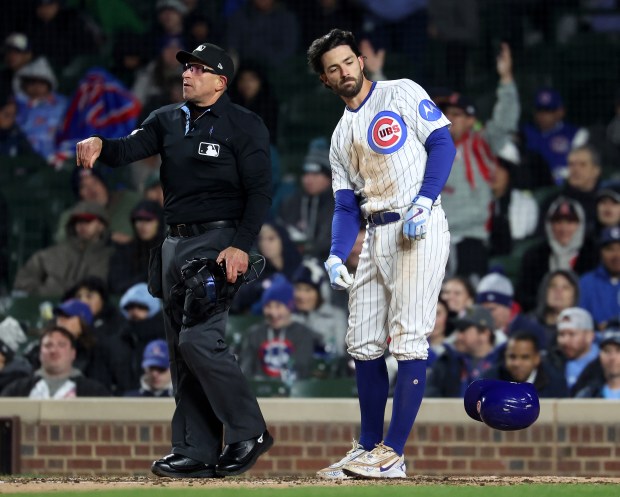 Chicago Cubs shortstop Dansby Swanson (7) tosses his helmet aside after striking out to end the fourth inning of a game against the Los Angeles Angels at Wrigley Field in Chicago on March 31, 2026. (Chris Sweda/Chicago Tribune)