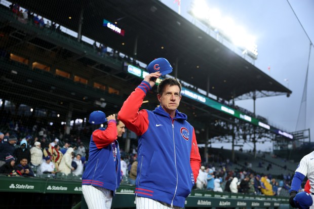 Chicago Cubs manager Craig Counsell (11) walks out of the dugout for the National Anthem before taking on the Los Angeles Angels at Wrigley Field in Chicago on March 31, 2026. (Chris Sweda/Chicago Tribune)