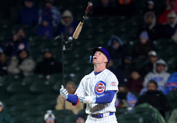 Chicago Cubs center fielder Pete Crow-Armstrong tosses his bat up in the air after striking out on a third strike foul bunt in the ninth inning of a game against the Los Angeles Angels at Wrigley Field in Chicago on March 31, 2026. (Chris Sweda/Chicago Tribune)