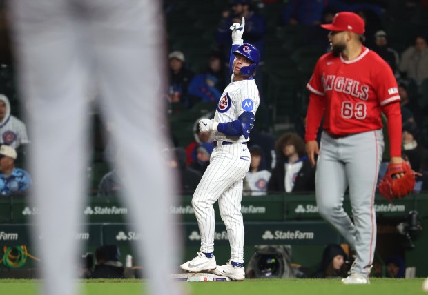 Chicago Cubs second baseman Nico Hoerner (2) celebrates at first base after his single in the seventh inning of a game against the Los Angeles Angels at Wrigley Field in Chicago on March 31, 2026. (Chris Sweda/Chicago Tribune)