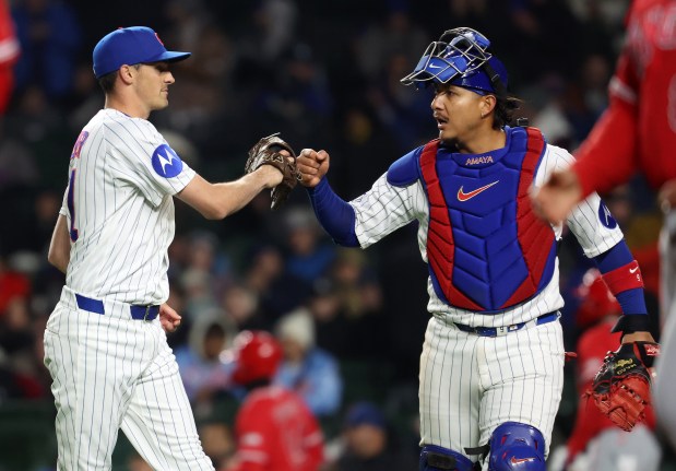 Chicago Cubs relief pitcher Hoby Milner and catcher Miguel Amaya (right) celebrate after Milner was able to retire the final Los Angeles Angels batter in the fifth inning of a game at Wrigley Field in Chicago on March 31, 2026. (Chris Sweda/Chicago Tribune)