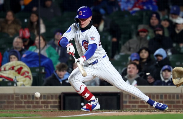 Chicago Cubs center fielder Pete Crow-Armstrong (4) lays down a sacrifice bunt in the fourth inning of a game against the Los Angeles Angels at Wrigley Field in Chicago on March 31, 2026. (Chris Sweda/Chicago Tribune)