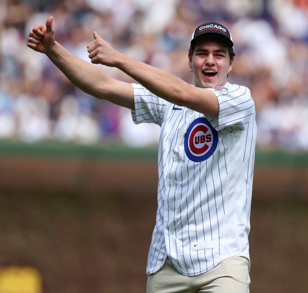 Chicago Blackhawks center Anton Frondell reacts after throwing out a ceremonial first pitch before the start of a game between the Chicago Cubs and the New York Mets at Wrigley Field in Chicago on April 17, 2026. (Chris Sweda/Chicago Tribune)