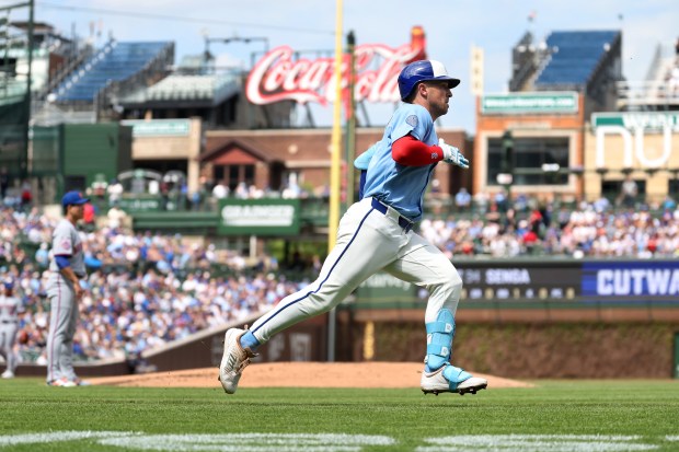Chicago Cubs third baseman Alex Bregman (3) runs down the line on a single in the first inning of a game against the New York Mets at Wrigley Field in Chicago on April 17, 2026. (Chris Sweda/Chicago Tribune)