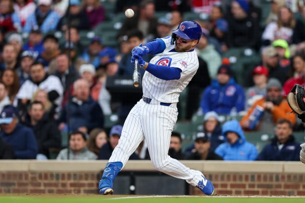 Cubs first baseman Michael Busch (29) hits a fly out during the first inning against the Phillies at Wrigley Field April 20, 2026, in Chicago. (Armando L. Sanchez/Chicago Tribune)