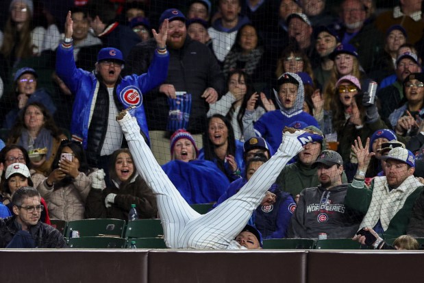 Cubs first baseman Michael Busch (29) misses a foul ball from Phillies right fielder Adolis García (53) during the fifth inning at Wrigley Field April 20, 2026, in Chicago. (Armando L. Sanchez/Chicago Tribune)