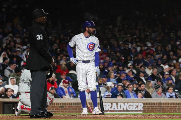 Cubs shortstop Dansby Swanson (7) stands at the plate during an ABS review during the sixth inning at Wrigley Field April 20, 2026, in Chicago. (Armando L. Sanchez/Chicago Tribune)