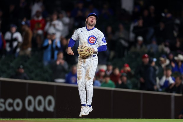 Cubs second baseman Nico Hoerner (2) celebrates after catching a ball from Phillies left fielder Kyle Schwarber (12) during the seventh inning at Wrigley Field April 20, 2026, in Chicago. (Armando L. Sanchez/Chicago Tribune)