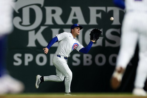 Cubs third baseman Matt Shaw (6) catches a fly out from Phillies right fielder Adolis García (53) during the eighth inning at Wrigley Field April 20, 2026, in Chicago. (Armando L. Sanchez/Chicago Tribune)