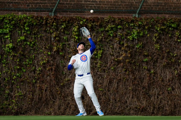 Cubs left fielder Ian Happ (8) catches a fly out from Phillies center fielder Brandon Marsh (16) during the eighth inning at Wrigley Field April 20, 2026, in Chicago. (Armando L. Sanchez/Chicago Tribune)