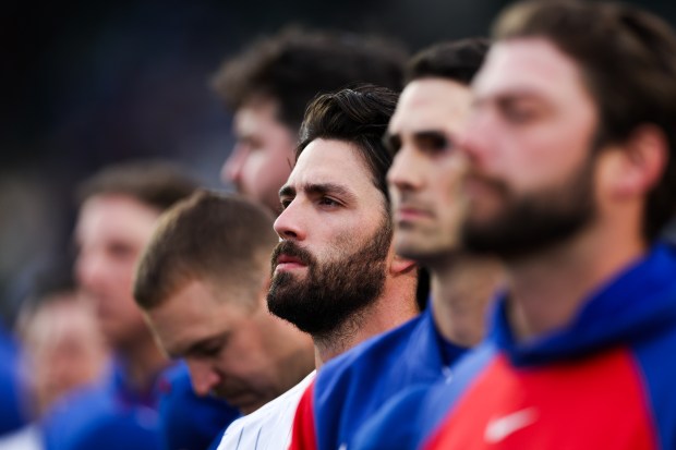 Cubs shortstop Dansby Swanson (7) stands with other players during the national anthem before the Cubs play the Phillies at Wrigley Field April 20, 2026, in Chicago. (Armando L. Sanchez/Chicago Tribune)
