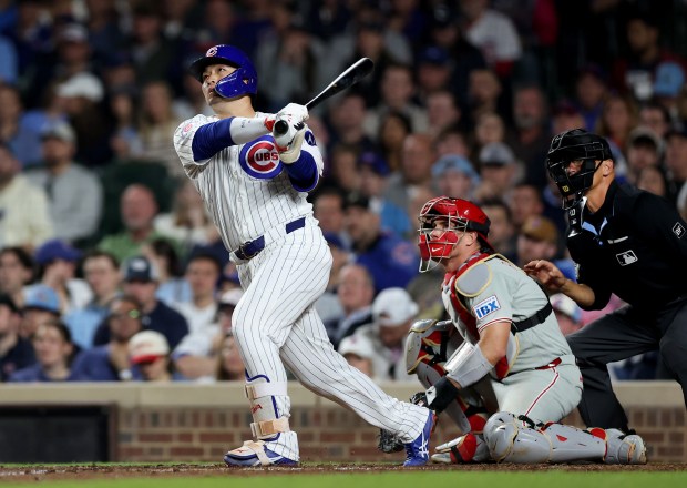 Chicago Cubs right fielder Seiya Suzuki (27) hits a two-run home run in the seventh inning of a game against the Philadelphia Phillies at Wrigley Field in Chicago on April 21, 2026. (Chris Sweda/Chicago Tribune)