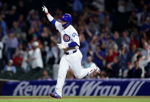 Chicago Cubs right fielder Seiya Suzuki celebrates as he rounds the bases after hitting a two-run home run in the seventh inning of a game against the Philadelphia Phillies at Wrigley Field in Chicago on April 21, 2026. (Chris Sweda/Chicago Tribune)
