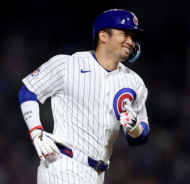 Chicago Cubs right fielder Seiya Suzuki celebrates as he rounds the bases after hitting a two-run home run in the seventh inning of a game against the Philadelphia Phillies at Wrigley Field in Chicago on April 21, 2026. (Chris Sweda/Chicago Tribune)