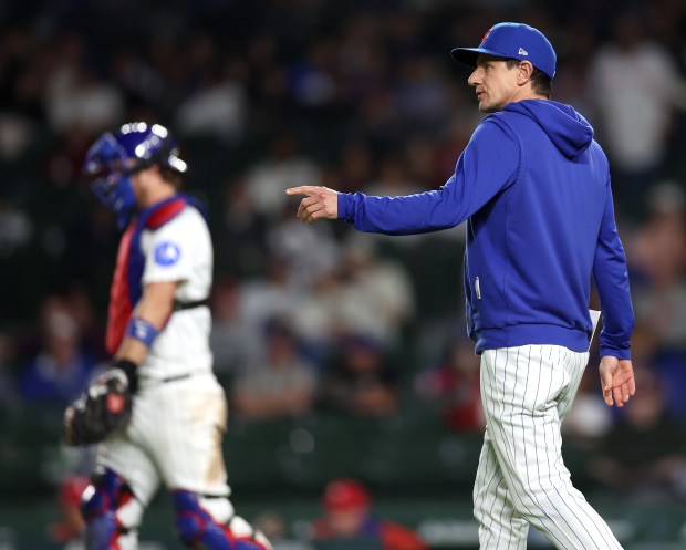 Chicago Cubs manager Craig Counsell (11) makes a pitching change in the ninth inning of a game against the Philadelphia Phillies at Wrigley Field in Chicago on April 21, 2026. (Chris Sweda/Chicago Tribune)