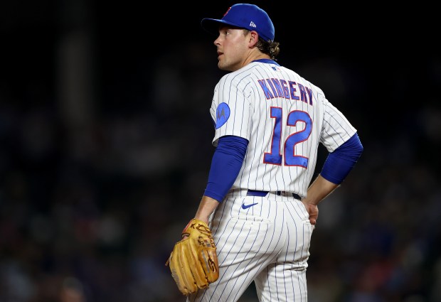 Chicago Cubs third baseman Scott Kingery (12) stands on the infield in the ninth inning of a game against the Philadelphia Phillies at Wrigley Field in Chicago on April 21, 2026. (Chris Sweda/Chicago Tribune)
