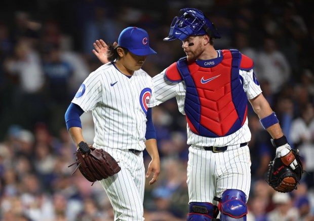 Chicago Cubs catcher Carson Kelly (right) congratulates starting pitcher Shota Imanaga after the duo closed out the Philadelphia Phillies in the seventh inning of a game at Wrigley Field in Chicago on April 21, 2026. (Chris Sweda/Chicago Tribune)