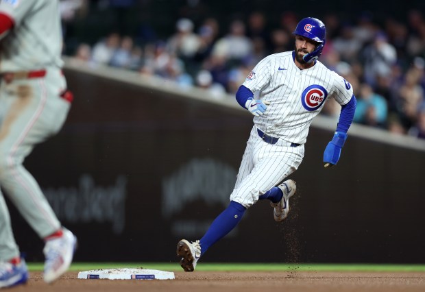 Chicago Cubs shortstop Dansby Swanson (7) rounds second base as he advances to third base in the fourth inning of a game against the Philadelphia Phillies at Wrigley Field in Chicago on April 21, 2026. (Chris Sweda/Chicago Tribune)