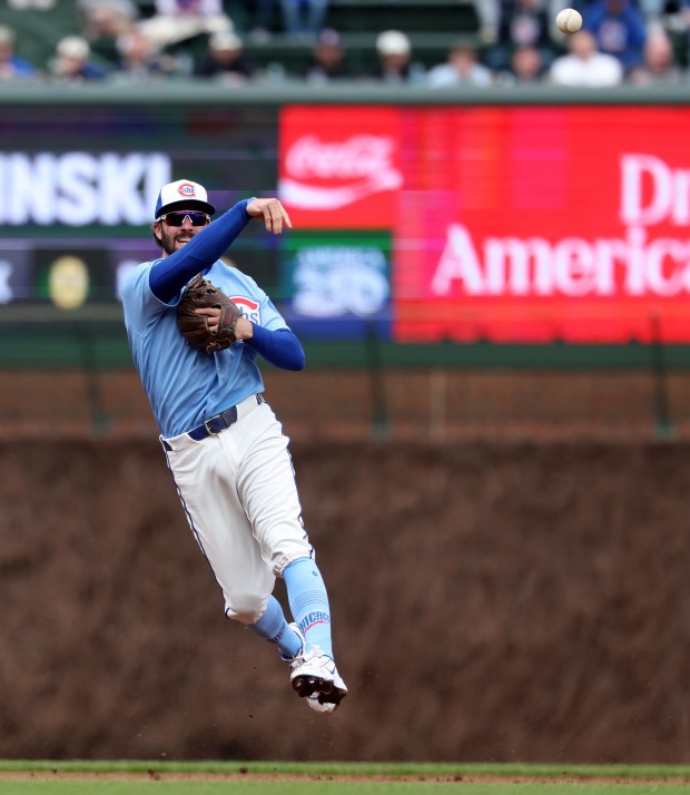 Chicago Cubs shortstop Dansby Swanson (7) throws to first base on a ground out by the Pittsburgh Pirates in the first inning of a game at Wrigley Field in Chicago on April 10, 2026. (Chris Sweda/Chicago Tribune)