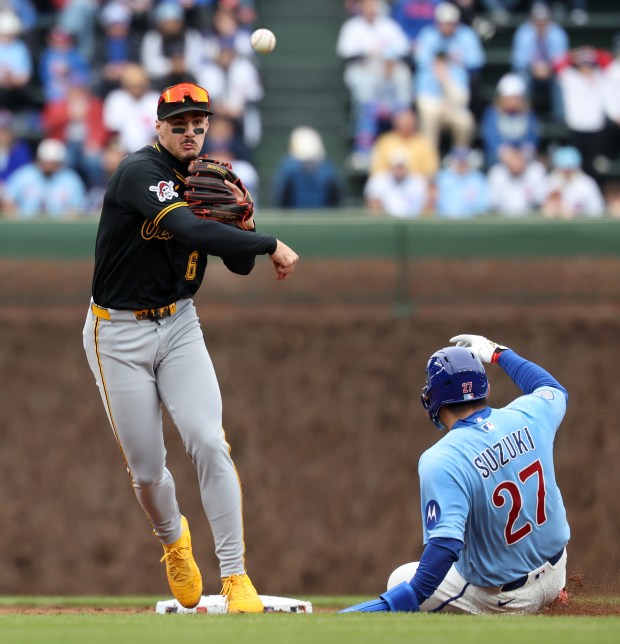Pittsburgh Pirates shortstop Konnor Griffin throws to first base after forcing out Chicago Cubs right fielder Seiya Suzuki at second base as Pete Crow-Armstrong grounds into a double play to end the second inning of a game at Wrigley Field in Chicago on April 10, 2026. (Chris Sweda/Chicago Tribune)