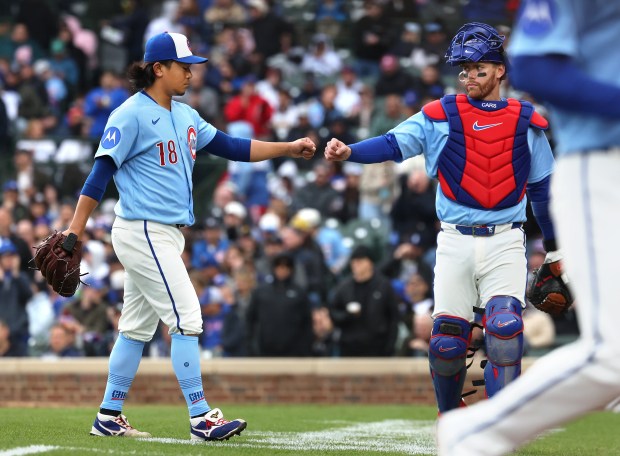 Chicago Cubs pitcher Shota Imanaga (18) and catcher Carson Kelly congratulate one another after finishing off the Pittsburgh Pirates in the sixth inning of a game at Wrigley Field in Chicago on April 10, 2026. (Chris Sweda/Chicago Tribune)