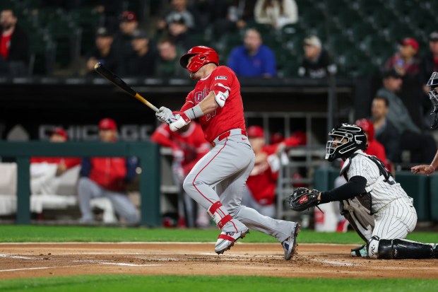 Angels right fielder Mike Trout (27) hits a double during the first inning against the White Sox after a three hour rain delay at Rate Field April 27, 2026, in Chicago. (Armando L. Sanchez/Chicago Tribune)