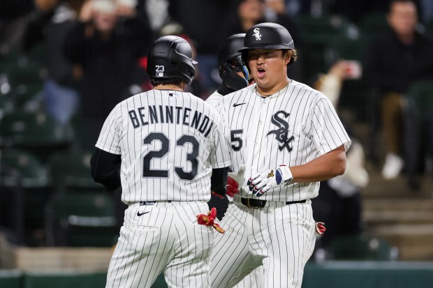 White Sox first baseman Munetaka Murakami (5) celebrates with White Sox left fielder Andrew Benintendi (23) after hitting a three-run home run during the seventh inning against the Angels at Rate Field April 27, 2026, in Chicago. (Armando L. Sanchez/Chicago Tribune)