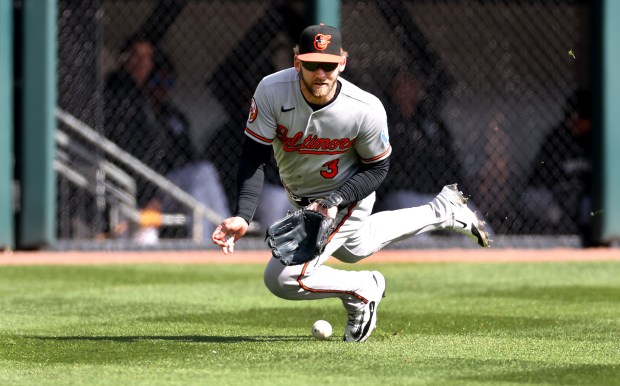 Baltimore Orioles left fielder Taylor Ward (3) is unable to make a catch of a ball that went for a run-scoring double for Chicago White Sox second baseman Chase Meidroth in the third inning of a game at Rate Field in Chicago on April 7, 2026. (Chris Sweda/Chicago Tribune)