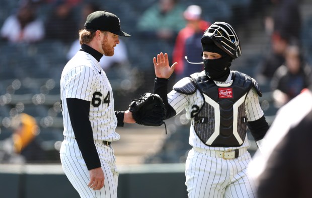 Chicago White Sox starting pitcher Shane Smith (64) and catcher Edgar Quero (26) congratulated one another after getting out of jam to end the second inning of a game against the Baltimore Orioles at Rate Field in Chicago on April 7, 2026. (Chris Sweda/Chicago Tribune)