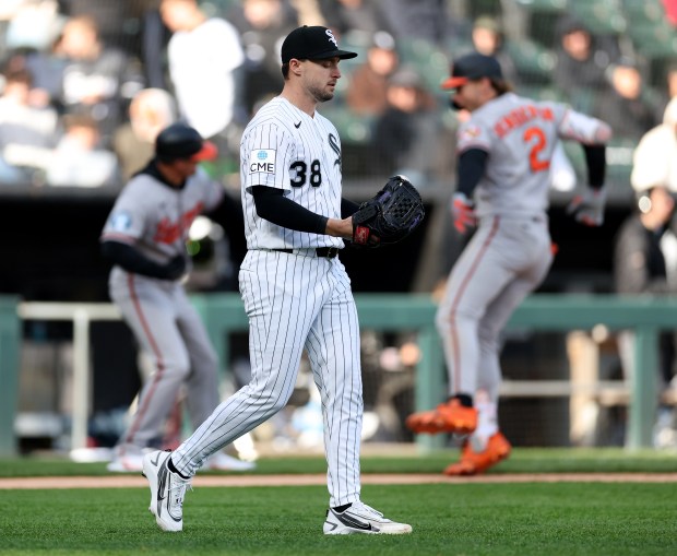 Chicago White Sox relief pitcher Chris Murphy (38) walks back to the mound as Baltimore Orioles designated hitter Gunnar Henderson (right) celebrates as he rounds the bases after hitting a 2-run home run off of Murphy in the eighth inning of a game at Rate Field in Chicago on April 7, 2026. (Chris Sweda/Chicago Tribune)