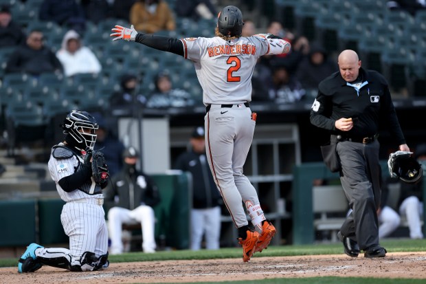 Baltimore Orioles designated hitter Gunnar Henderson celebrates in front of Chicago White Sox catcher Edgar Quero after Henderson hit a 2-run home run in the eighth inning of a game at Rate Field in Chicago on April 7, 2026. (Chris Sweda/Chicago Tribune)