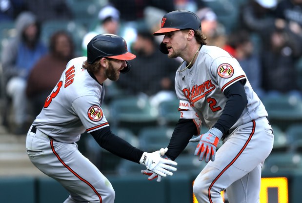 Baltimore Orioles designated hitter Gunnar Henderson (right) celebrates with teammate Taylor Ward (3) after Henderson hit a 2-run home run in the eighth inning of a game against the Chicago White Sox at Rate Field in Chicago on April 7, 2026. (Chris Sweda/Chicago Tribune)