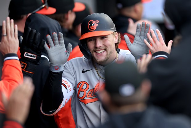 Baltimore Orioles designated hitter Gunnar Henderson is congratulated by his teammates in the dugout after hitting a 2-run home run in the eighth inning of a game against the Chicago White Sox at Rate Field in Chicago on April 7, 2026. (Chris Sweda/Chicago Tribune)