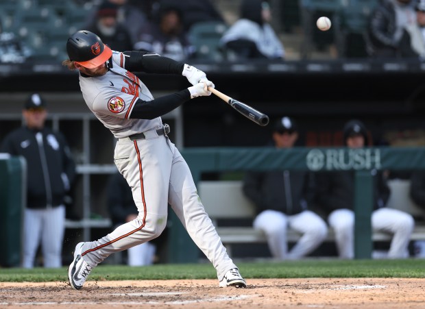 Baltimore Orioles left fielder Taylor Ward drives in a run on a double in the eighth inning of a game against the Chicago White Sox at Rate Field in Chicago on April 7, 2026. (Chris Sweda/Chicago Tribune)